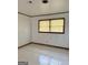 Bright bedroom featuring neutral walls, tile flooring, and natural light from the two windows at 6576 Randall Mark Dr, Morrow, GA 30260