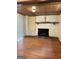 Stone fireplace, wood floors, with sliding glass doors and wood ceiling at 6576 Randall Mark Dr, Morrow, GA 30260