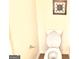Bathroom featuring a white toilet, beige walls, and wood-look flooring at 3311 Thornbridge Dr, Powder Springs, GA 30127