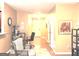 The living room features cozy chairs, a workspace, and hallway views leading to the front door at 3311 Thornbridge Dr, Powder Springs, GA 30127