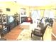 Comfortable living room with hardwood floors, a fireplace, and access to dining and kitchen areas at 3311 Thornbridge Dr, Powder Springs, GA 30127