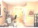 The living room features cozy chairs, a workspace, and hallway views leading to the front door at 3311 Thornbridge Dr, Powder Springs, GA 30127