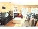 Inviting living room with a cozy fireplace, hardwood floors, and sliding door access to the outdoors at 3311 Thornbridge Dr, Powder Springs, GA 30127