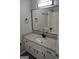 Bathroom features white vanity with a granite countertop and a large mirror at 6286 Saddlewood Dr, Lithonia, GA 30058