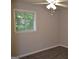 Bedroom with hardwood floors, ceiling fan, and a window with views of outside at 6286 Saddlewood Dr, Lithonia, GA 30058