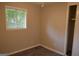 Cozy bedroom with a window view, hardwood flooring, and a closet with a sliding door at 6286 Saddlewood Dr, Lithonia, GA 30058