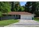 Charming single-story home features a spacious driveway and a two-car garage, perfect for a Gathering at 6286 Saddlewood Dr, Lithonia, GA 30058