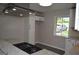 Well-lit kitchen featuring stone countertops and modern stainless steel appliances and fixtures at 6286 Saddlewood Dr, Lithonia, GA 30058