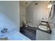 Bathroom featuring double sink vanity, toilet, and tub with decorative tile at 127 Jenny Rd, Grantville, GA 30220