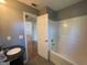 Bathroom view showing a tub, sink, and open door at 127 Jenny Rd, Grantville, GA 30220