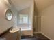 Bathroom showcasing a large soaking tub with a window and separate shower at 127 Jenny Rd, Grantville, GA 30220