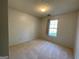Bedroom view showing carpet, window and light at 127 Jenny Rd, Grantville, GA 30220