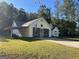 Charming single-story home with a welcoming front entrance, attached garage and a well-manicured lawn at 127 Jenny Rd, Grantville, GA 30220