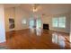 Bright living room with hardwood floors, a cozy fireplace, and access to the backyard at 127 Jenny Rd, Grantville, GA 30220