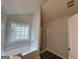 Modern bathroom featuring a tub, a glass shower, and new finishes at 127 Jenny Rd, Grantville, GA 30220