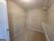 Walk-in closet with shelving units and carpet flooring at 127 Jenny Rd, Grantville, GA 30220