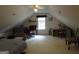 Spacious attic with sloped ceilings and dormer windows for natural light at 25 Lake Charles Ct, Covington, GA 30016