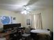 Functional bedroom with ample workspace, perfect for a home office or hobby room at 25 Lake Charles Ct, Covington, GA 30016