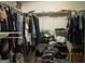 Walk-in closet providing plenty of storage with shelves and hanging racks at 25 Lake Charles Ct, Covington, GA 30016