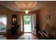 Inviting foyer with hardwood floors, decorative lighting, and a view of the outdoors through the doorway at 25 Lake Charles Ct, Covington, GA 30016