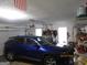 Garage with a vehicle, tools and equipment ready for projects and storage at 25 Lake Charles Ct, Covington, GA 30016
