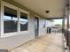 Back porch featuring wood floors and railings, with a view of the backyard at 72 S Bethany Rd, Mcdonough, GA 30252