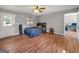 Bedroom with hardwood floors, neutral paint, ceiling fan and an exterior access door at 72 S Bethany Rd, Mcdonough, GA 30252