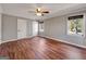 Neutral bedroom with wood-look flooring and two windows for ample natural light at 72 S Bethany Rd, Mcdonough, GA 30252