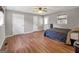Bedroom featuring hardwood floors, neutral paint, ceiling fan and closet with double doors at 72 S Bethany Rd, Mcdonough, GA 30252