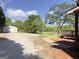 Exterior view of the house, detached garage, and lush lawn at 72 S Bethany Rd, Mcdonough, GA 30252