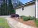 Home exterior with beautiful landscaping, including paver walkway and fresh pine straw at 72 S Bethany Rd, Mcdonough, GA 30252