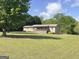 Secluded home with a sprawling lawn, mature trees and a charming front porch at 72 S Bethany Rd, Mcdonough, GA 30252