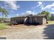 Exterior of the home with deck and gravel driveway at 72 S Bethany Rd, Mcdonough, GA 30252