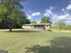 Tan home with a covered front porch and beautiful, well-manicured front yard with plenty of space at 72 S Bethany Rd, Mcdonough, GA 30252