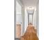 Hallway with wood-look floors leads to bath and bedroom at 72 S Bethany Rd, Mcdonough, GA 30252