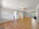 Expansive living room with hardwood floors and natural light from multiple windows at 72 S Bethany Rd, Mcdonough, GA 30252