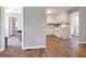 Open-concept living space showcases new flooring, with a view into the kitchen at 72 S Bethany Rd, Mcdonough, GA 30252