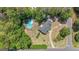 Aerial view of a home with a pool and surrounding trees at 12 Blackfoot Trl, Sharpsburg, GA 30277