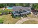 Expansive property featuring a pool, a well-maintained lawn, and a beautiful two-story home at 12 Blackfoot Trl, Sharpsburg, GA 30277