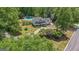 Spacious property featuring a well-maintained home, swimming pool, and mature trees at 12 Blackfoot Trl, Sharpsburg, GA 30277