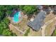 Captivating aerial view of the property highlighting the backyard pool and well-maintained landscaping at 12 Blackfoot Trl, Sharpsburg, GA 30277
