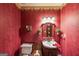 Charming bathroom with vintage wallpaper, a classic vanity, and unique decorative touches at 12 Blackfoot Trl, Sharpsburg, GA 30277