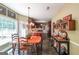 Open-concept dining room with tile flooring and adjacent kitchen and backyard access at 12 Blackfoot Trl, Sharpsburg, GA 30277