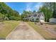 Beautiful two-story home with a long driveway and well-manicured lawn at 12 Blackfoot Trl, Sharpsburg, GA 30277