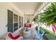 Cozy front porch with a swing, comfortable seating, and charming decor for outdoor relaxation at 12 Blackfoot Trl, Sharpsburg, GA 30277