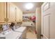 Laundry room with washer, dryer, and overhead storage at 12 Blackfoot Trl, Sharpsburg, GA 30277