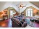Attic Living room with hardwood floors and ample seating at 12 Blackfoot Trl, Sharpsburg, GA 30277