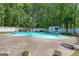 Resort-style pool area with a diving board and plenty of seating for entertaining at 12 Blackfoot Trl, Sharpsburg, GA 30277