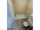 Bathroom features a tub, toilet and tilework; ready for a remodel at 4081 Jodeco Rd, Stockbridge, GA 30281