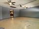 Spacious garage featuring two ceiling fans and an entry door to the kitchen area at 4081 Jodeco Rd, Stockbridge, GA 30281